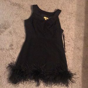 Black dress with feathered bottom worn once.